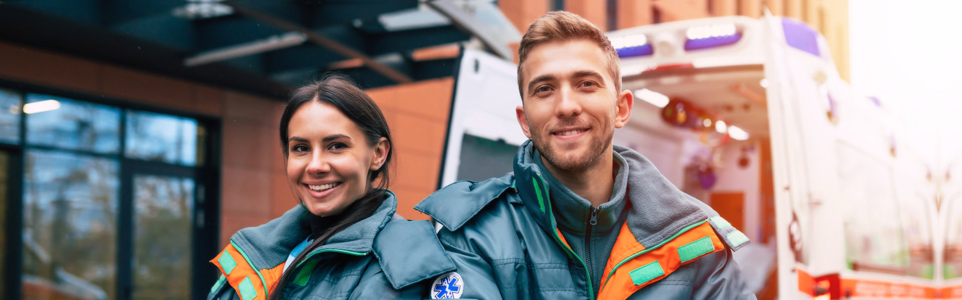 Two confident young doctors looking on the camera